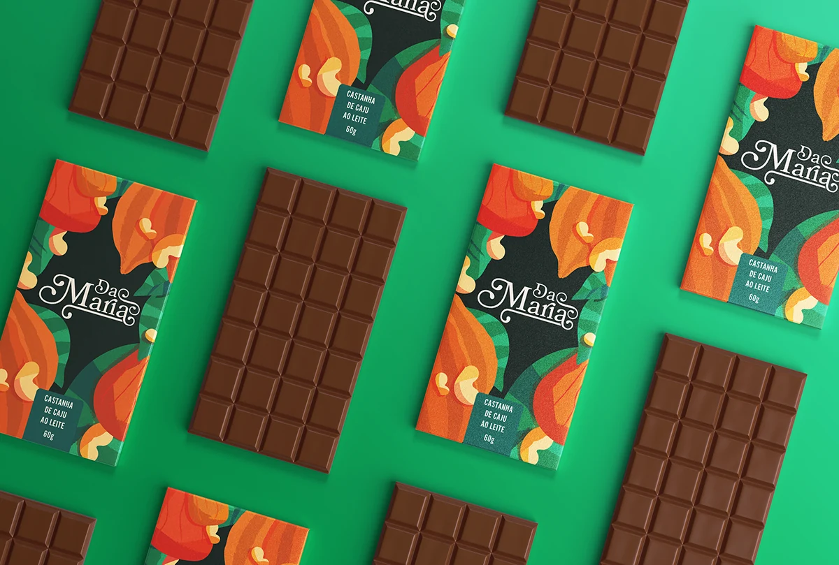 Chocolates e embalagens Da Maria distribuídos sobre fundo verde