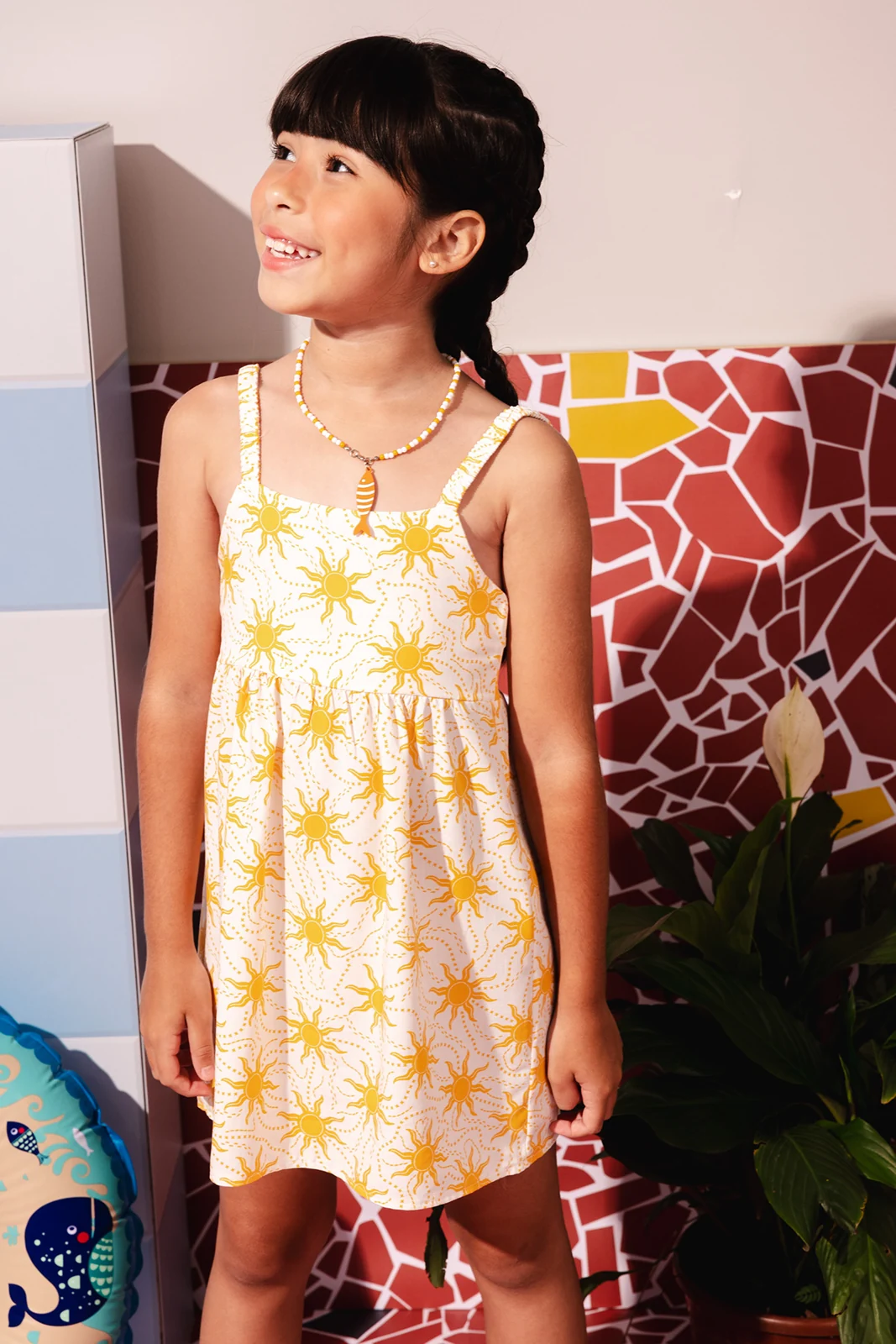 Aplicação da estampa de sol em vestido infantil — Lojas Objetiva